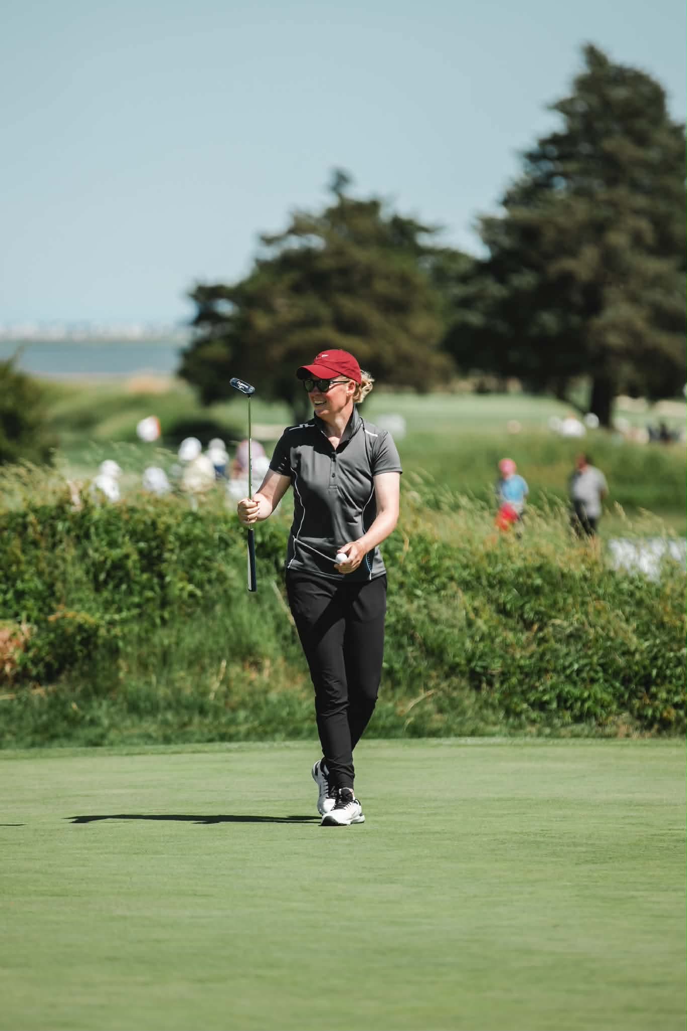 Nicole playing golf
